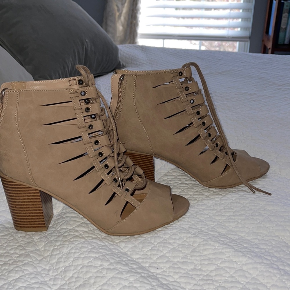 Rampage open toe strappy lace up boots.